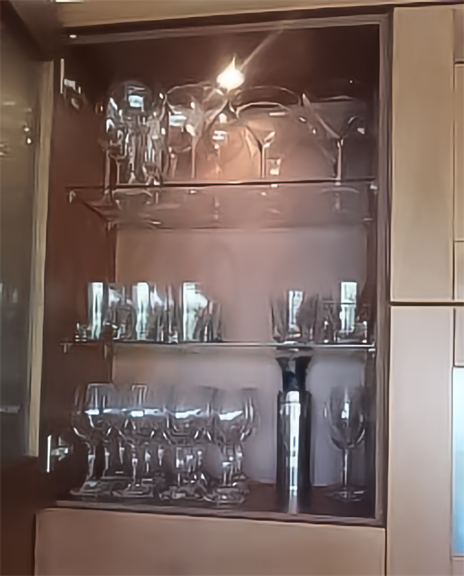 Immaculate glassware display cabinet — vacation rental cleaning